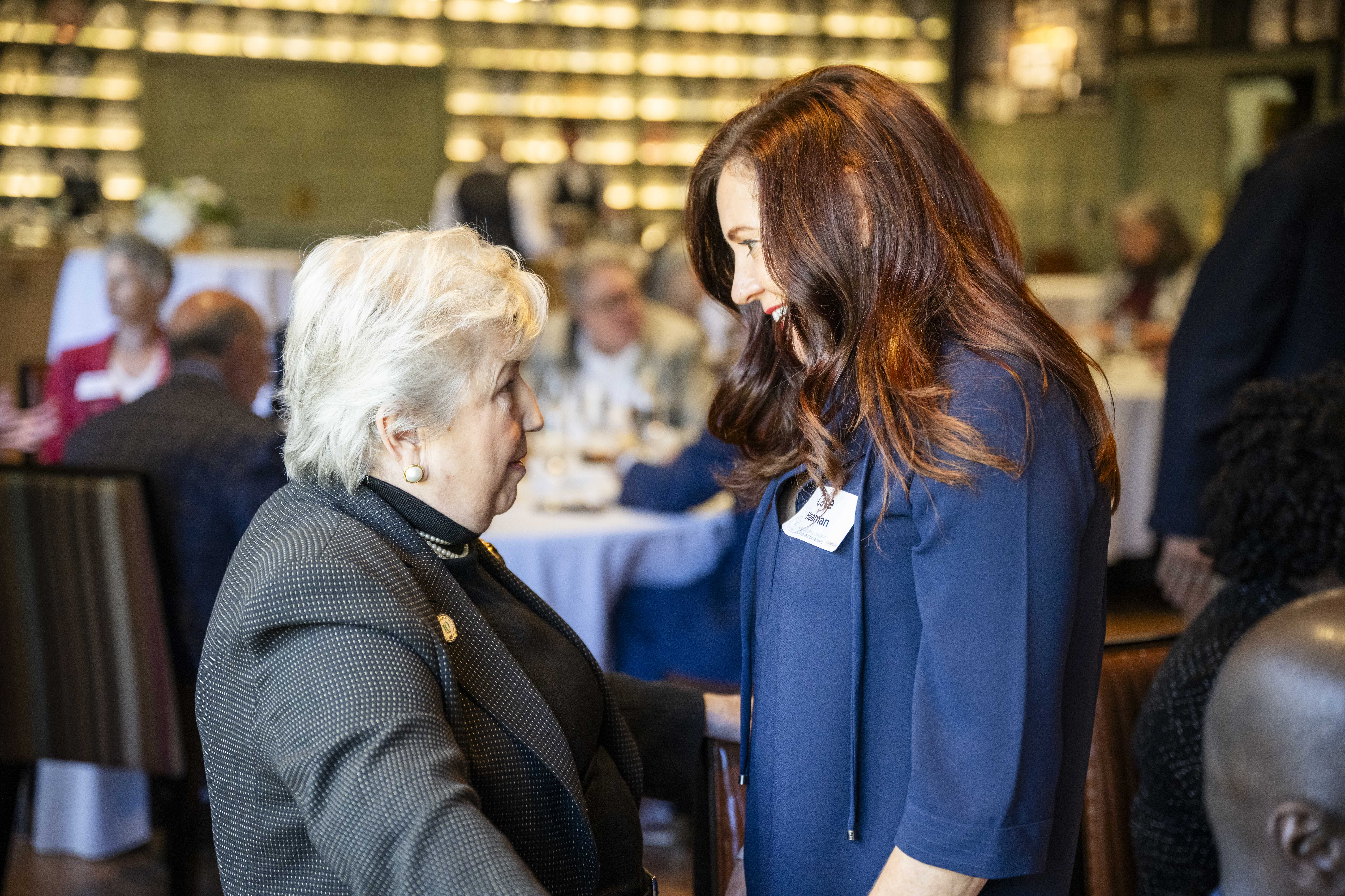 Cate and Candida at an event greeting each other